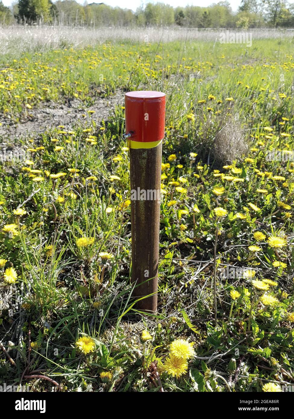 Groundwater pipe on a meadow Stock Photo Alamy