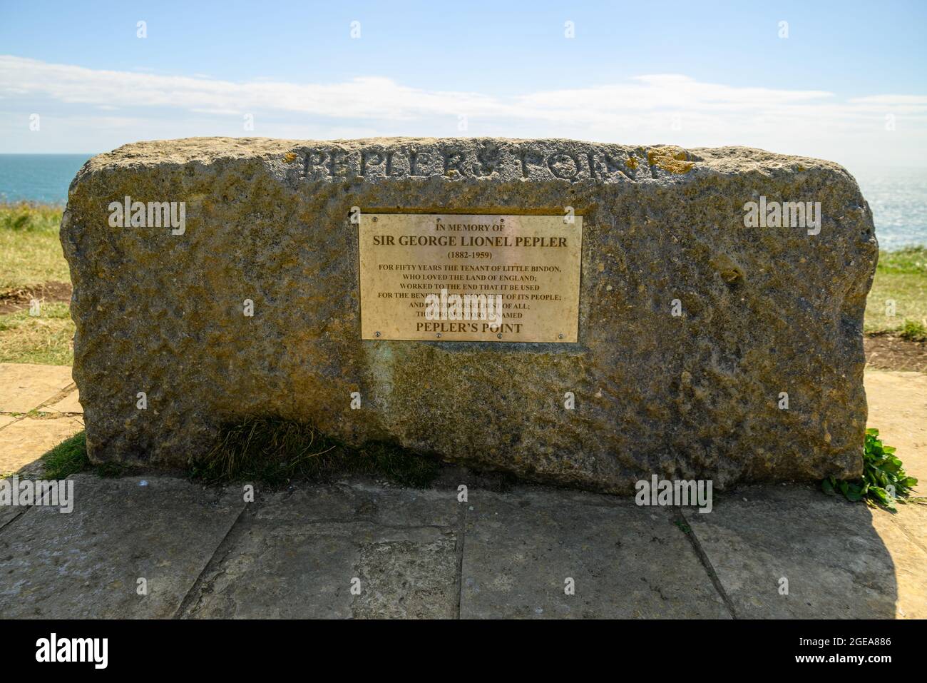 Memorial stone to Sir George Lionel Pepler on Pepler's Point headland, Lulworth Cove, West Lulworth, Dorset, UK Stock Photo
