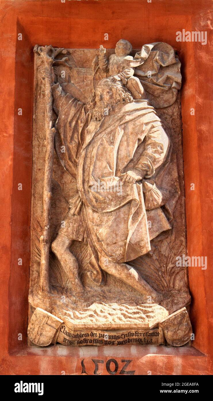 Bas-Relief sculpture of St, Christopher carrying the Christ child across a river (above entrance of St. George's Chapel at Hohensalzburg Fortress, . Stock Photo