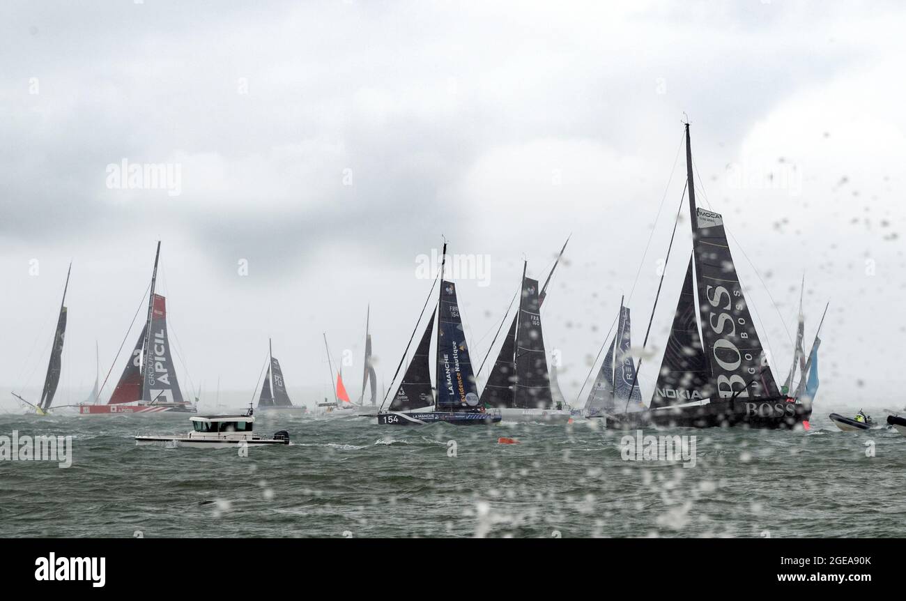 Start of the Imoca 60 fleet in the 2021 Rolex Fastnet Race, Cowes, Isle of Wight, England Stock Photo