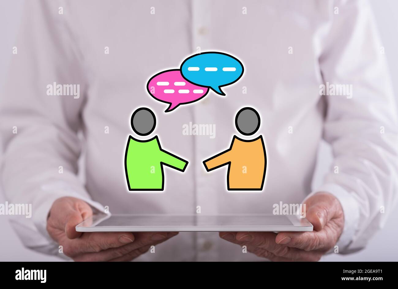 Dialog Tablet Dialog concept above a tablet held by a man in background Stock Photo ...