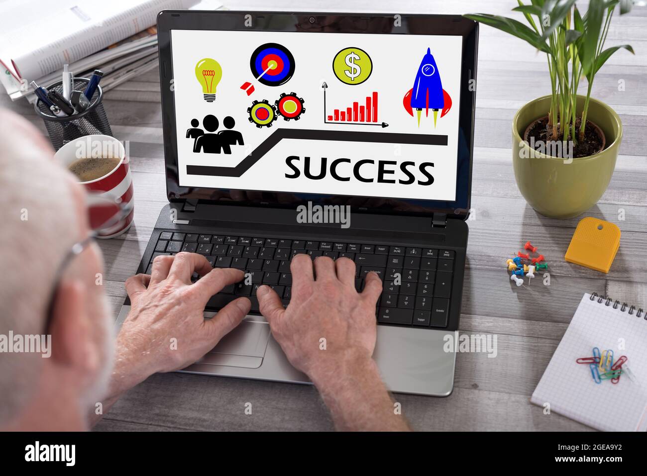 Success Computer Version Success concept shown on a laptop used by a man Stock Photo - Alamy