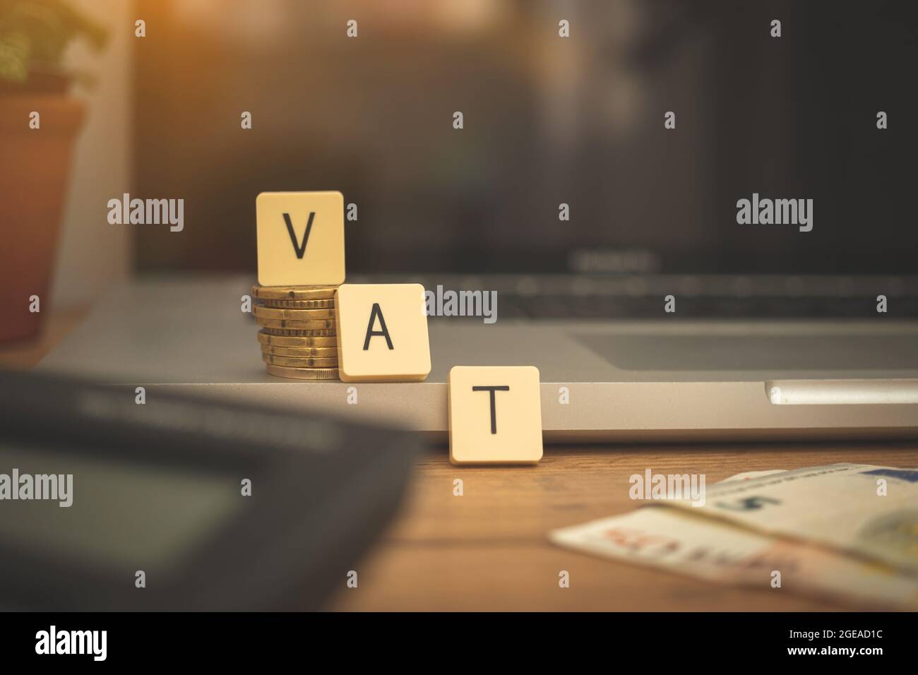 VAT background, Word VAT on business desktop with laptop, calculator