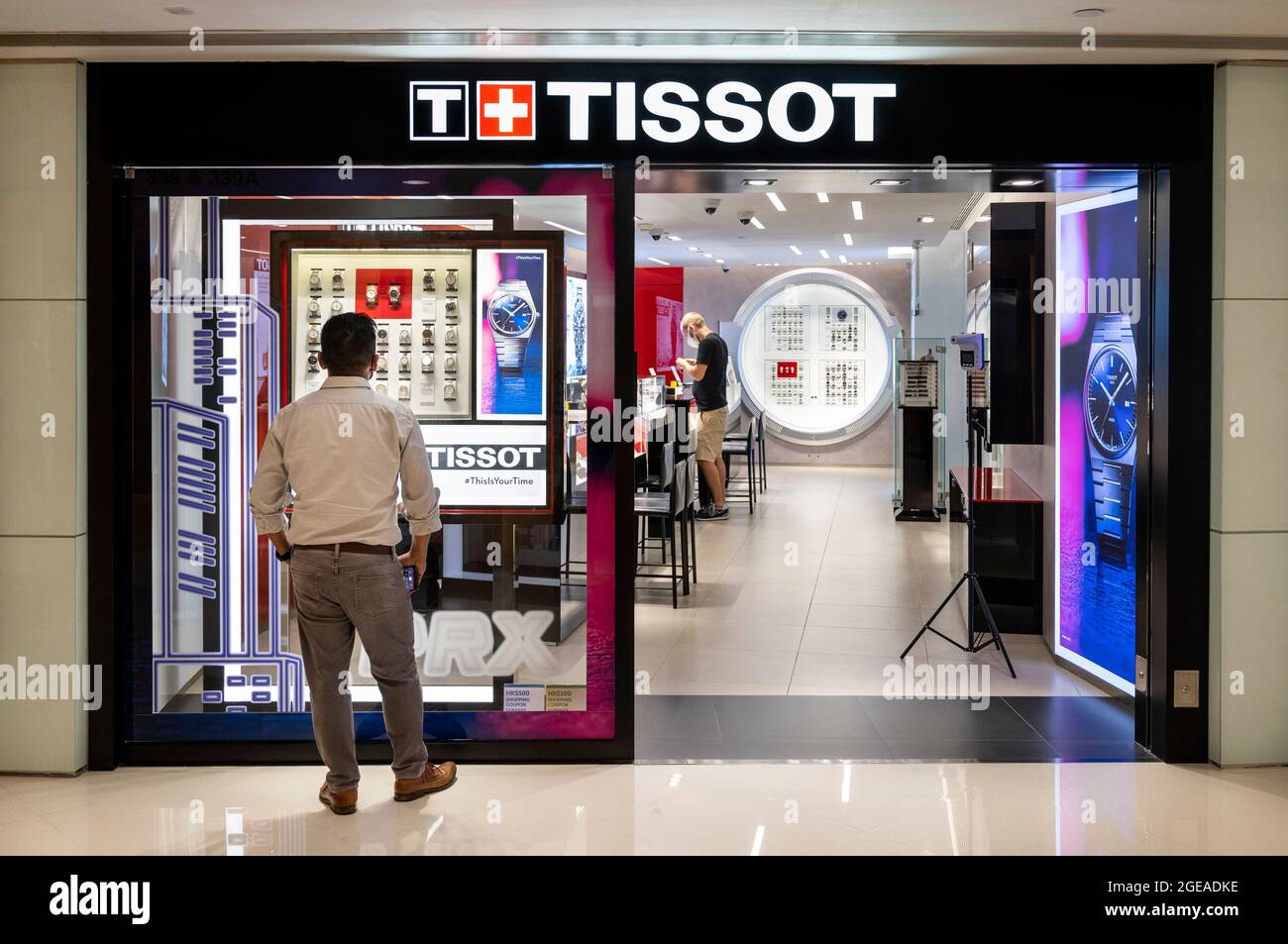 A shopper is seen at the Swiss watchmaker Tissot store in Hong