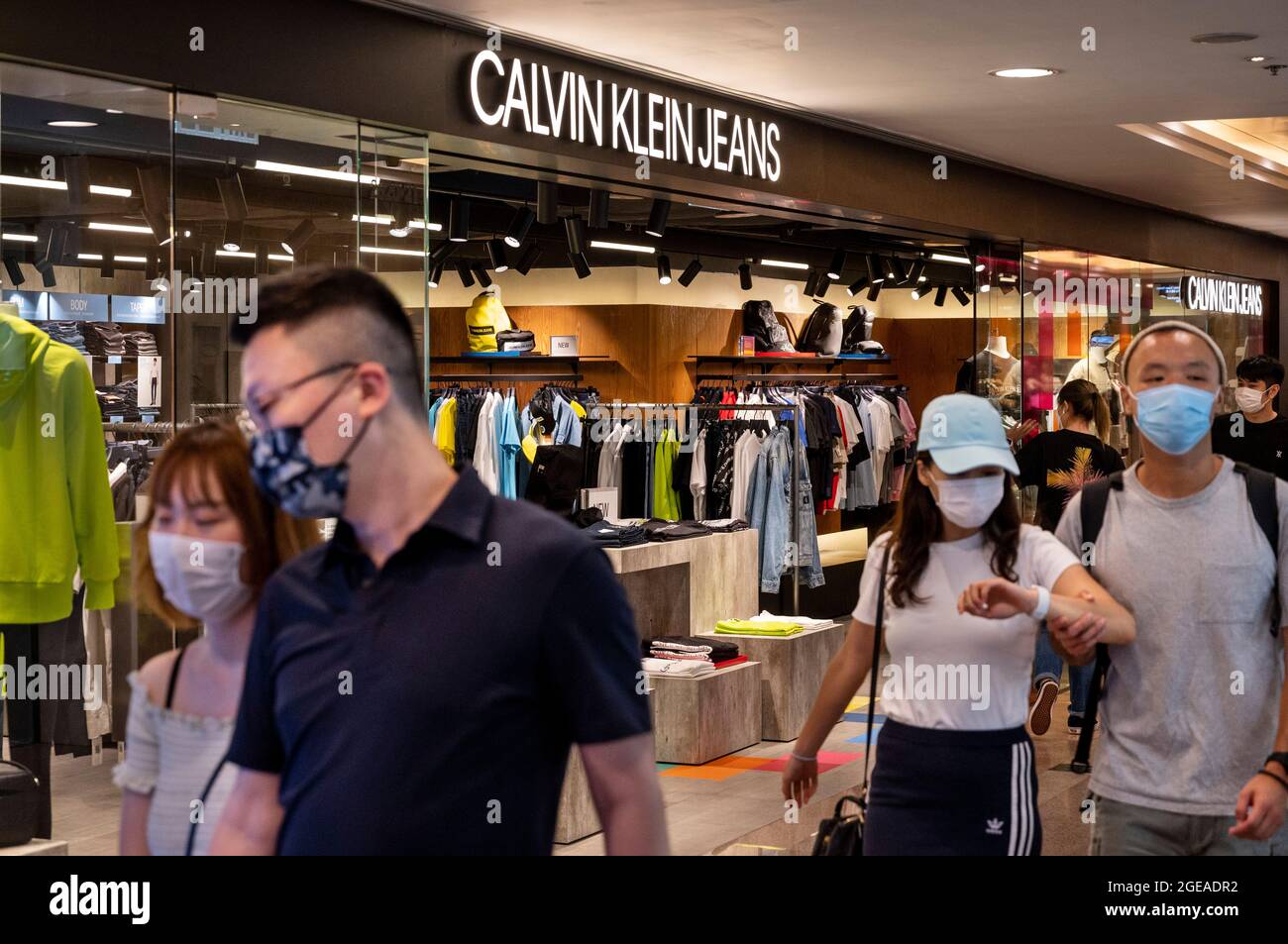 Hong Kong, China. 18th Aug, 2021. Shoppers walk past the American  multinational fashion brand, Calvin Klein Jeans store in Hong Kong. (Photo  by Budrul Chukrut/SOPA Images/Sipa USA) Credit: Sipa USA/Alamy Live News