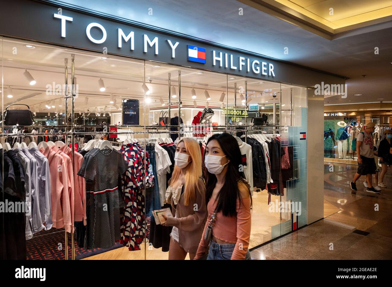 Shoppers walk past the American multinational clothing fashion brand, Tommy  Hilfiger store seen in Hong Kong. (Photo by Budrul Chukrut / SOPA  Images/Sipa USA Stock Photo - Alamy