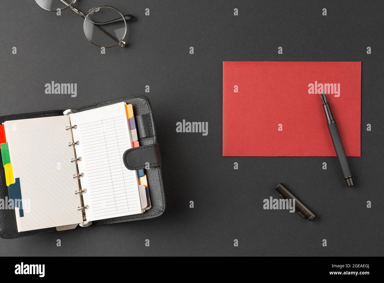 Envelope with fountain pen organizer and glasses Stock Photo - Alamy