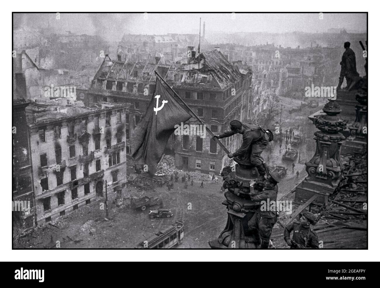 RUSSIAN ARMY BERLIN SOVIET FLAG OVER NAZI REICHSTAG World War II Germany Iconic image of raising a Russian Soviet flag over the Reichstag, an historic World War II photograph, taken during the Battle of Berlin on 2 May 1945. It shows Meliton Kantaria and Mikhail Yegorov raising the Hammer and Sickle flag over the Berlin Reichstag Berlin Germany WW2 Red Army Soviet Soldiers Hammer and Sickle Soviet flag Nazi Headquarters Reichstag, Berlin Germany 1945 - Stock Photo