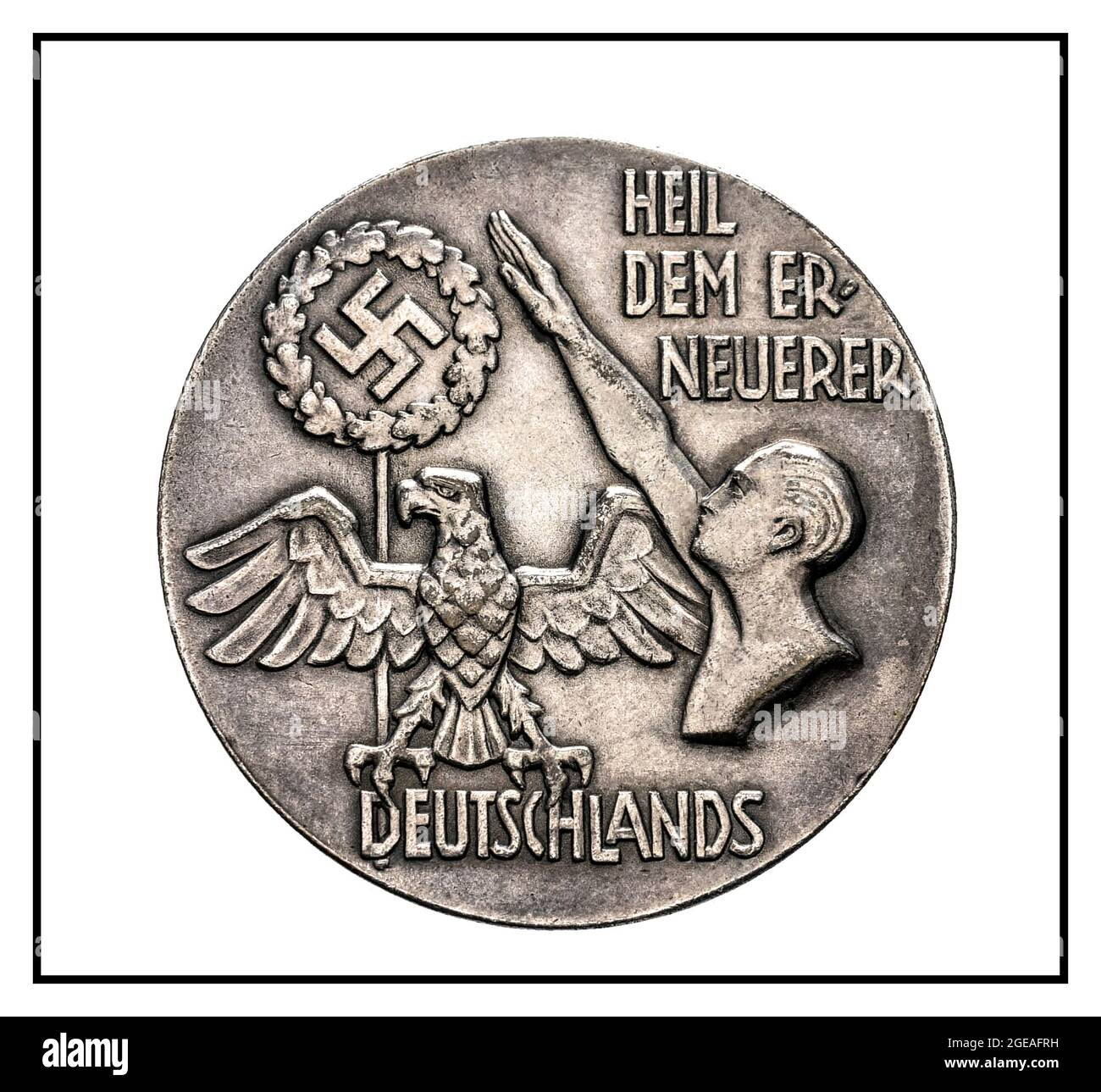 Heil to the renewer HEIL DEM ER NEUERER DEUTSCHLANDS medal propaganda plaque with German Eagle and Swastika with Heil Hitler salute 1930’s Nazi Germany commemorative award Stock Photo