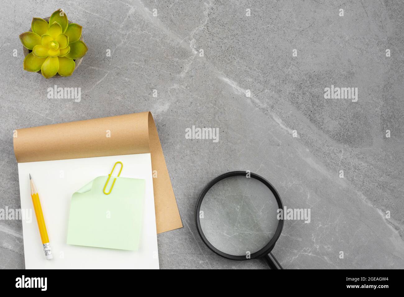 Open notepad on gray marble background Stock Photo