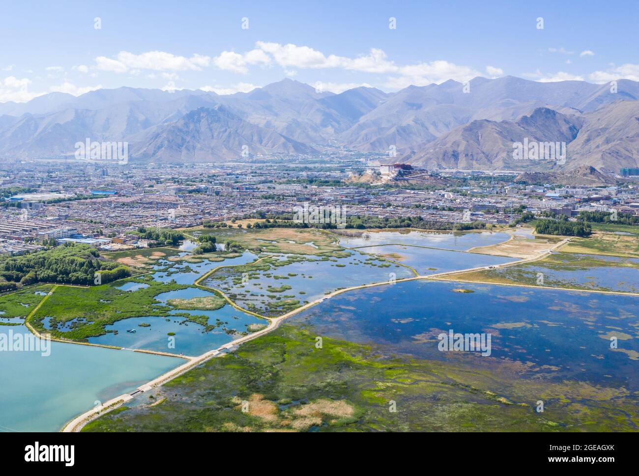 (210818) -- LHASA, Aug. 18, 2021 (Xinhua) -- Aerial photo taken on June 5, 2019 shows a view of Lhalu Wetland National Nature Reserve in Lhasa, southwest China's Tibet Autonomous Region. On May 23, 1951, the Agreement of the Central People's Government and the Local Government of Tibet on Measures for the Peaceful Liberation of Tibet (17-Article Agreement) was signed, officially proclaiming the peaceful liberation of Tibet. The year 2021 marks the 70th anniversary of the historic event. (Xinhua/Purbu Zhaxi) Stock Photo