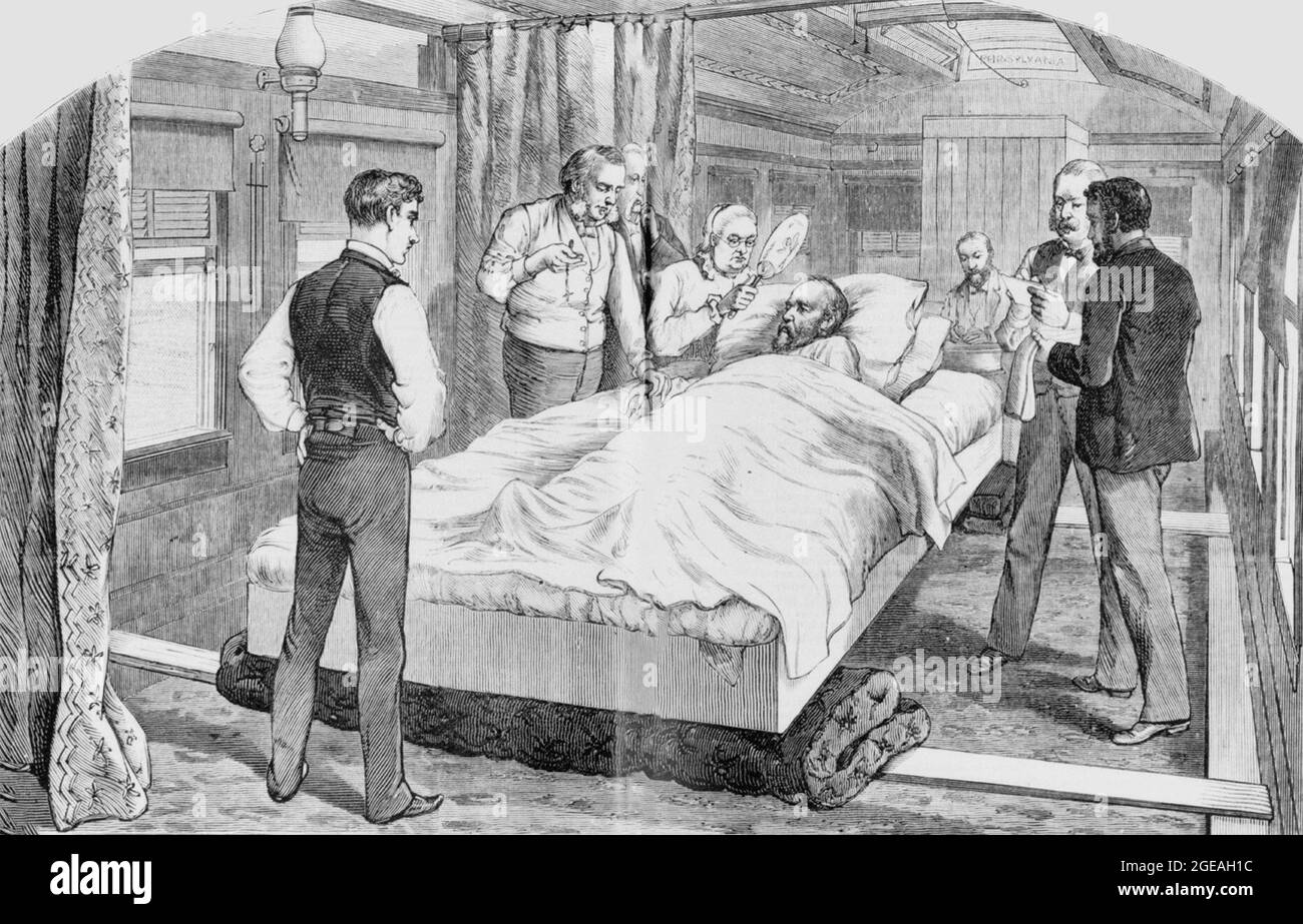 The interior of the train car that transported President James Garfield from Washington, DC to Elberon, NJ and the bed he was carried in on Stock Photo