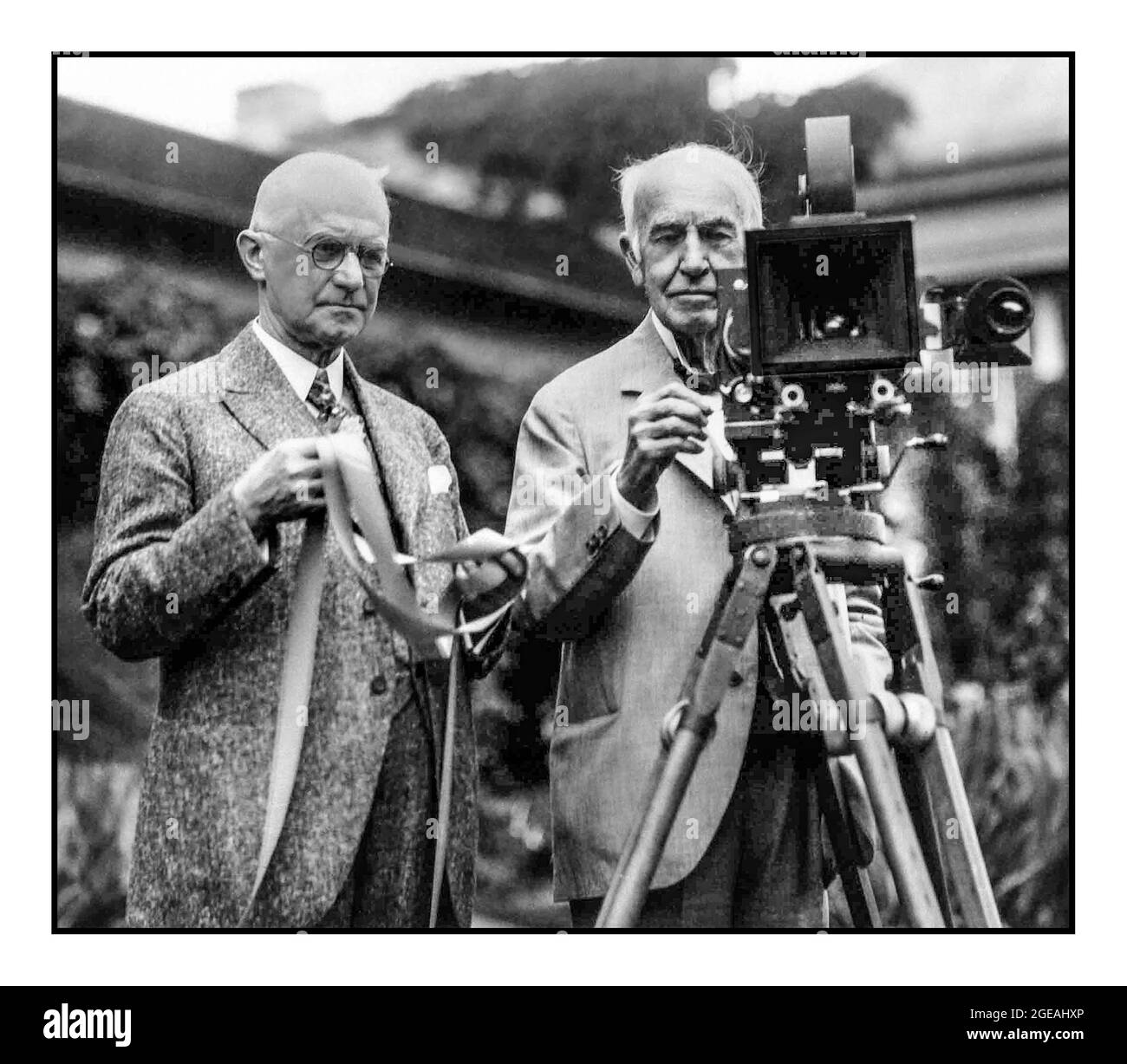 George Eastman and Thomas Edison  In July 1928, George Eastman and Thomas Edison introduced their color motion picture film to the world.  Inventor Thomas Edison and George Eastman pose for a portrait with a motion picture camera and film at Eastman's house in 1928 in Rochester, New York. USA Stock Photo