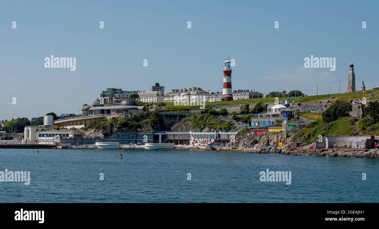 Plymouth, Devon, England, UK. 2021. View of the Plymouth waterfront properties seen from Plymouth Sound viewing Plymouth Hoe, Smeatons Tower and Tinsi Stock Photo