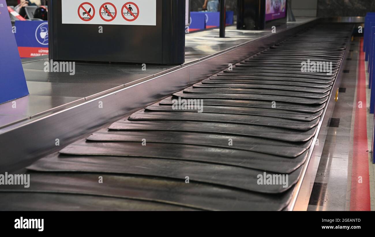 Empty suitcase or luggage with conveyor belt at the airport Stock Photo
