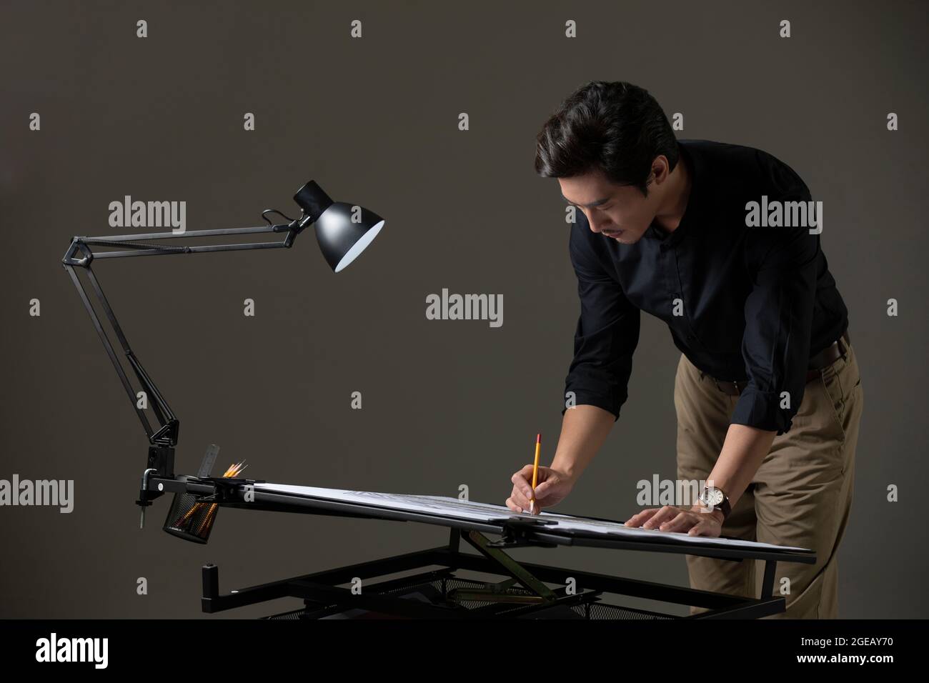 Chinese designer working on construction plan Stock Photo
