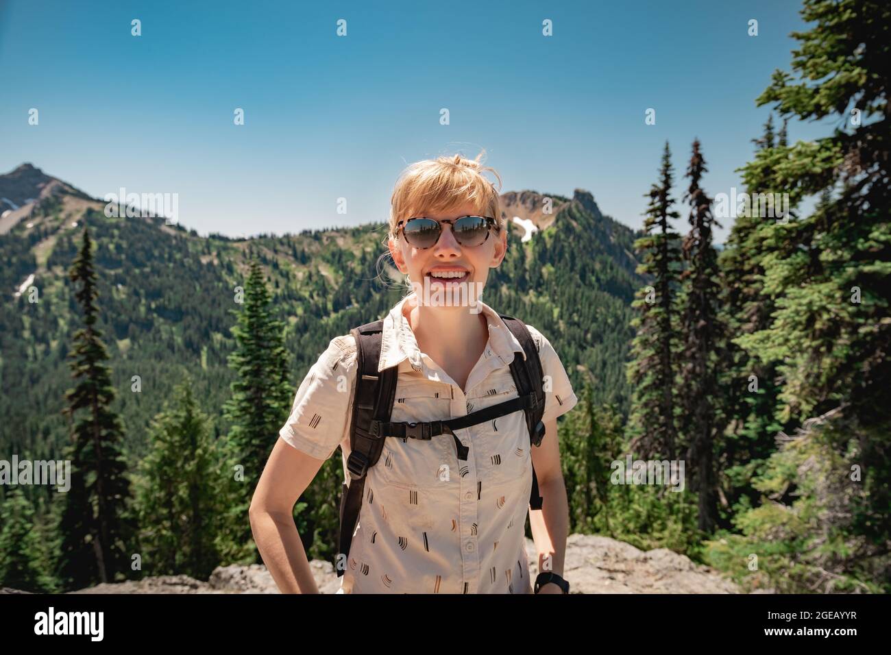Young woman hiking on the Naches Peak Loop Trail in Mt. Rainier National Park. Stock Photo