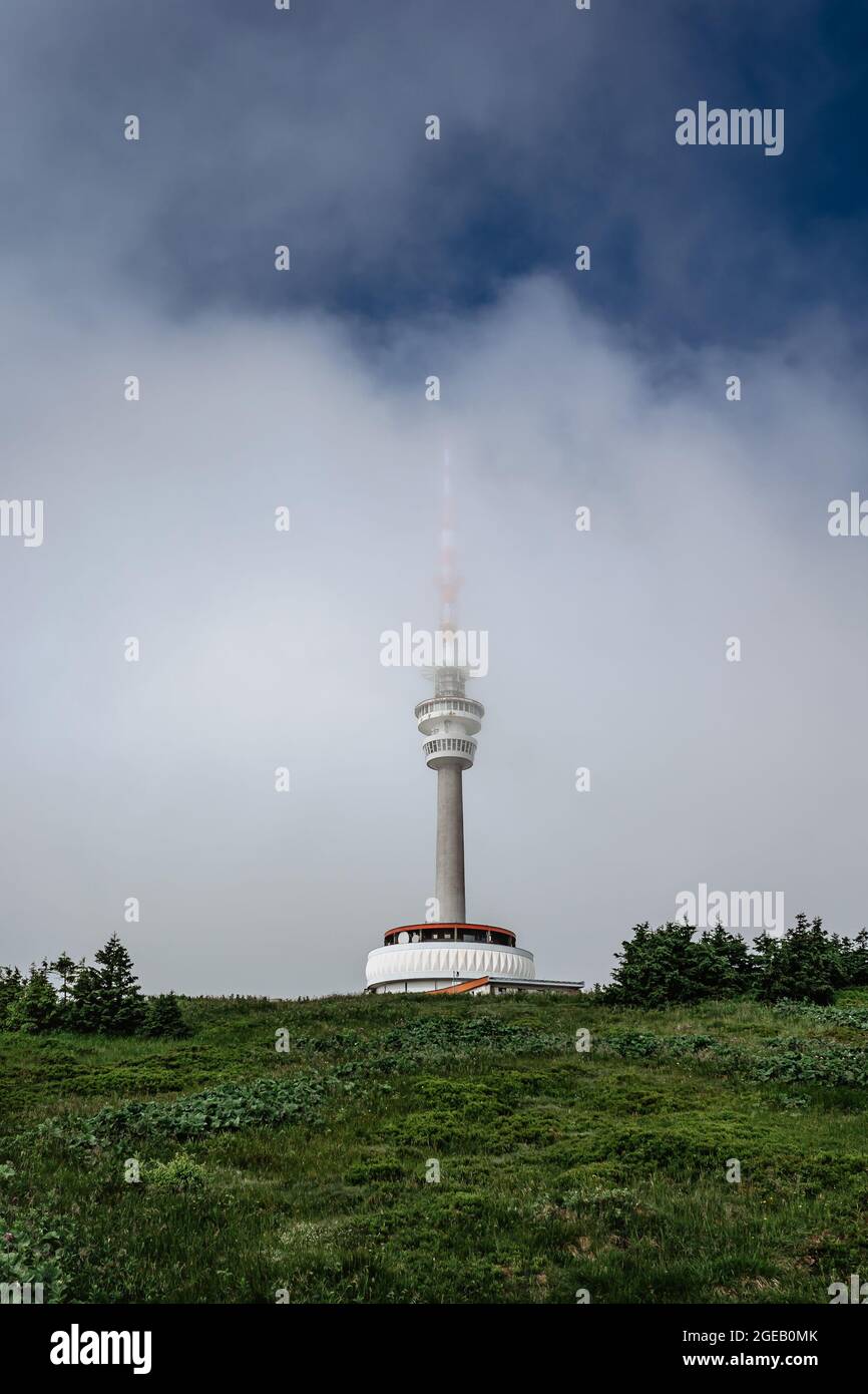 Television transmitter tower with observation platform on foggy peak of Praded,Jeseniky mountains,Czech republic.Views of picturesque countryside Stock Photo