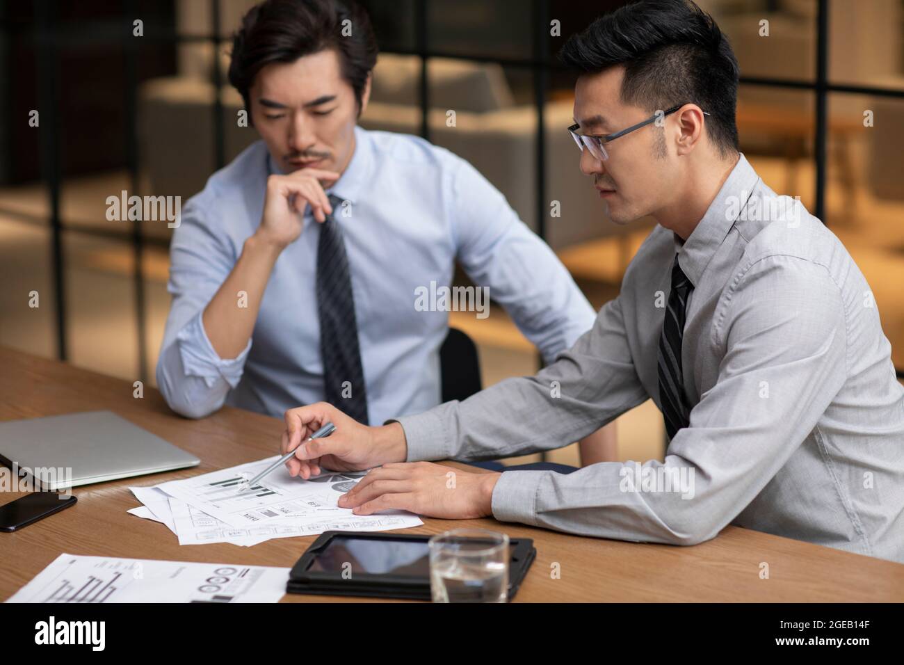 Manager Asian Report Successful Chinese businessmen analyzing report in office Stock Photo ...