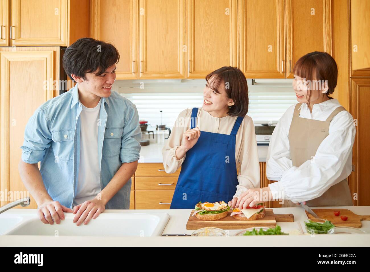 Japanese friends cooking at home Stock Photo