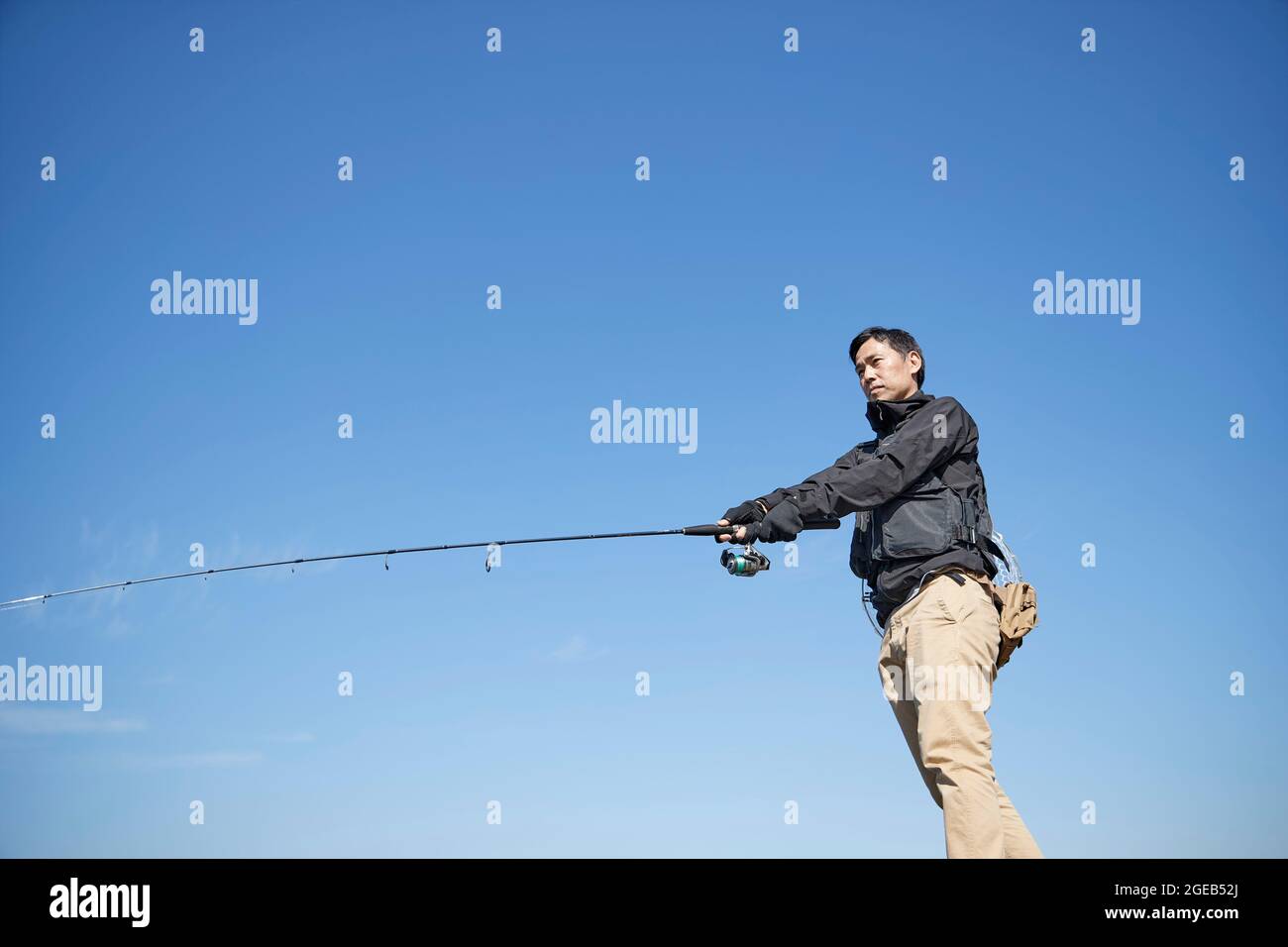 Japanese man fishing Stock Photo