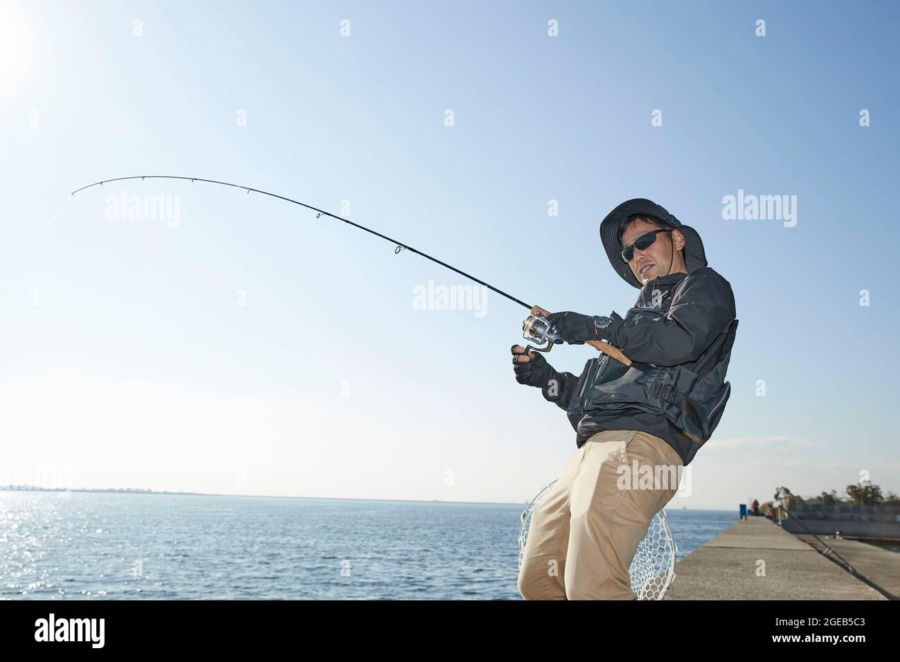Japanese man fishing Stock Photo