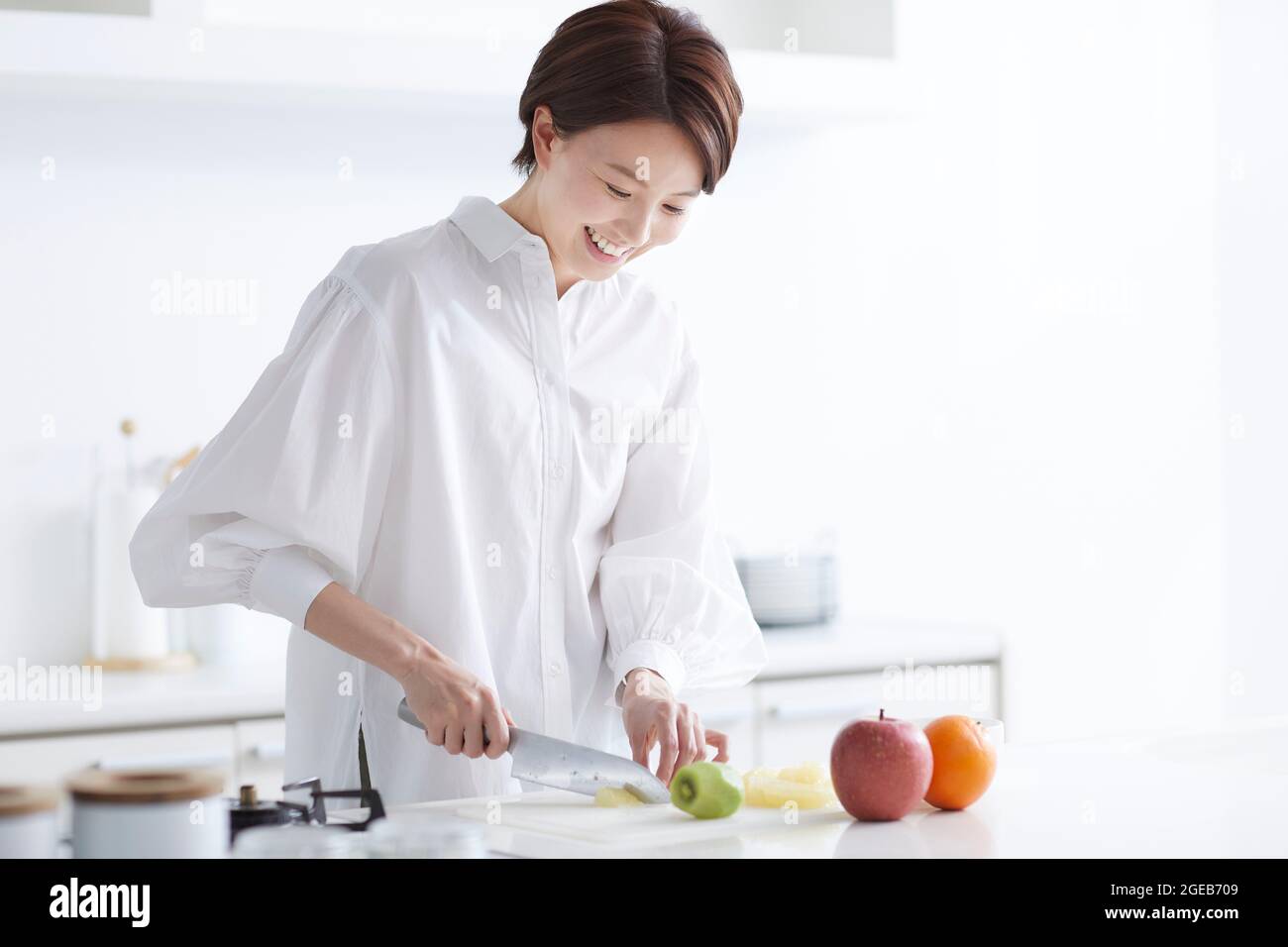 Japanese woman cooking at home Stock Photo