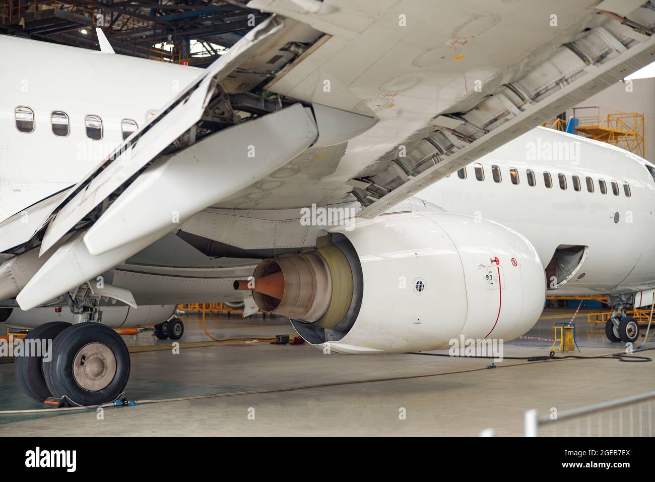 Close up shot of aircraft engine jet under maintenance in the hangar indoors Stock Photo