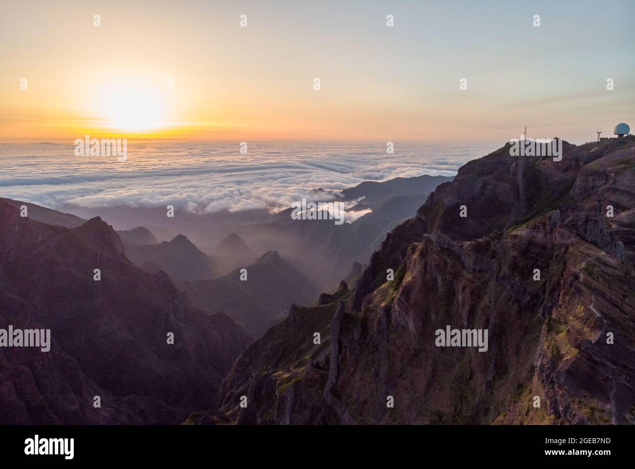 Spectacular landscape view of sunrise rising above sea of clouds ...