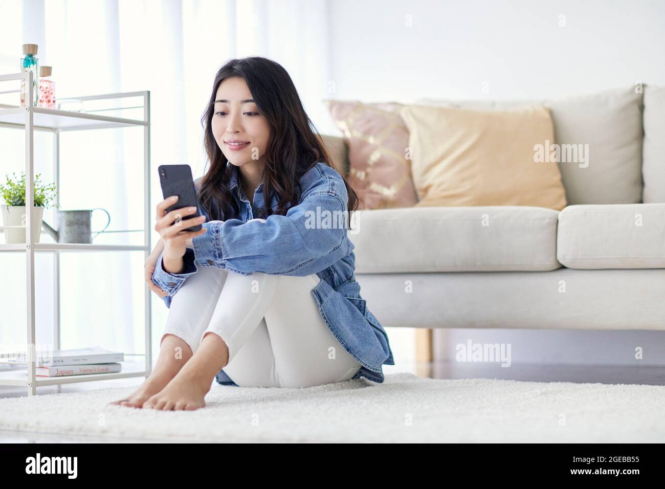 Japanese woman enjoying time at home Stock Photo