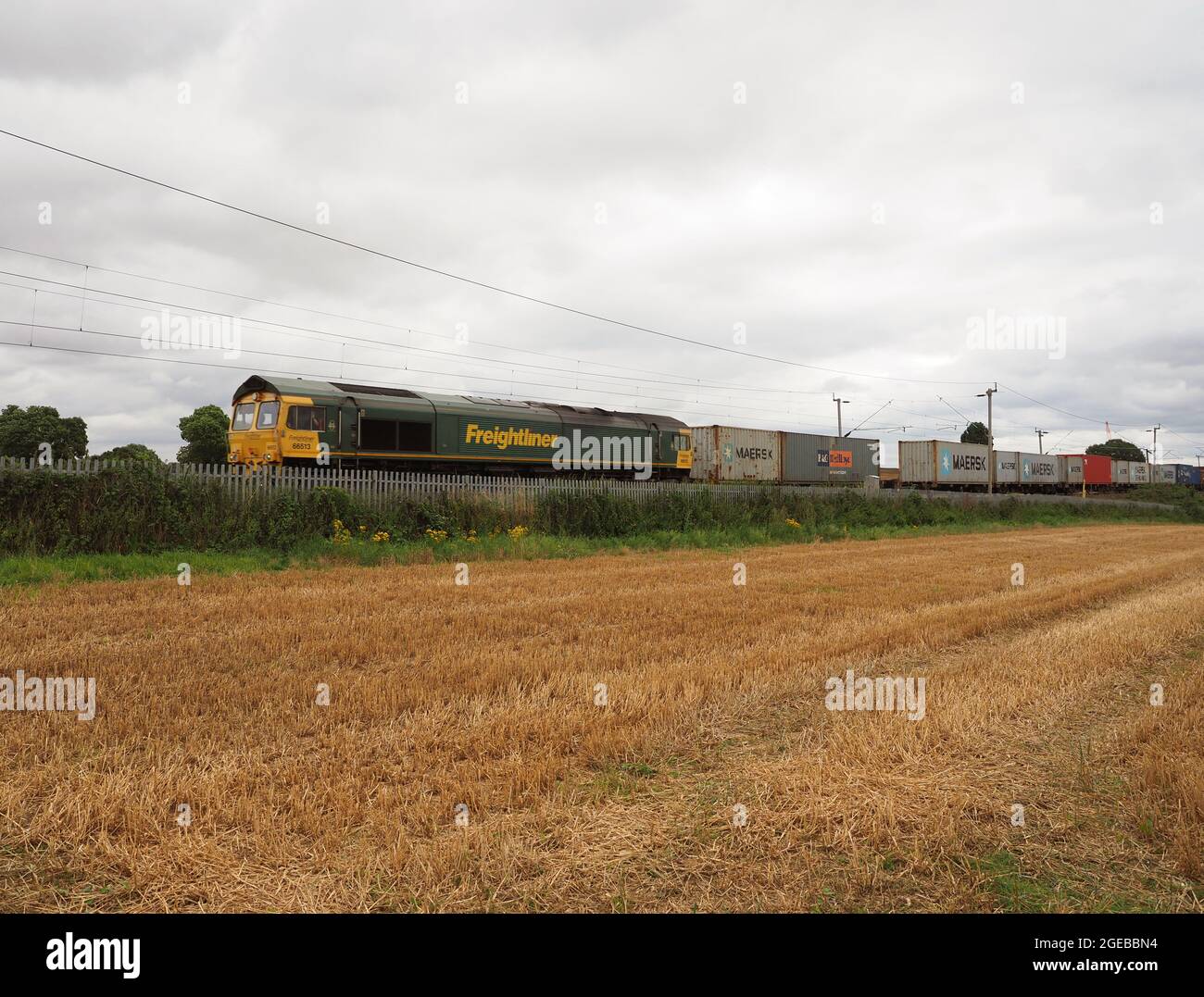 Freightliner Class 66 Locomotive 66513 hauls an intermodal train through Northamptonshire, UK Stock Photo