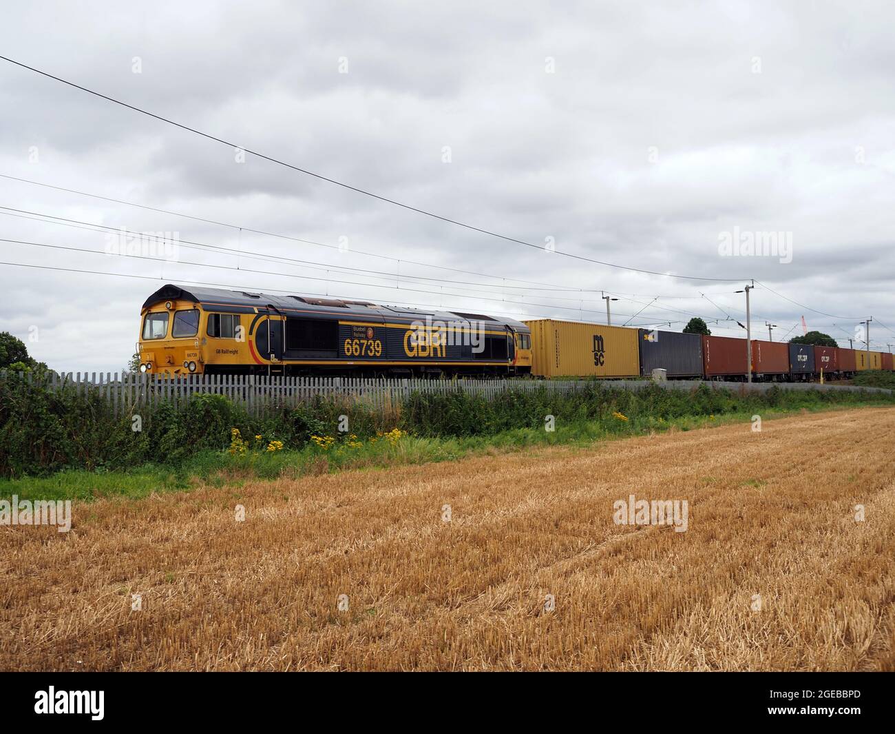 GBRF Class 66 locomotive 66739 'Bluebell Railway' hauls an intermodal train through Northamptonshire, UK Stock Photo