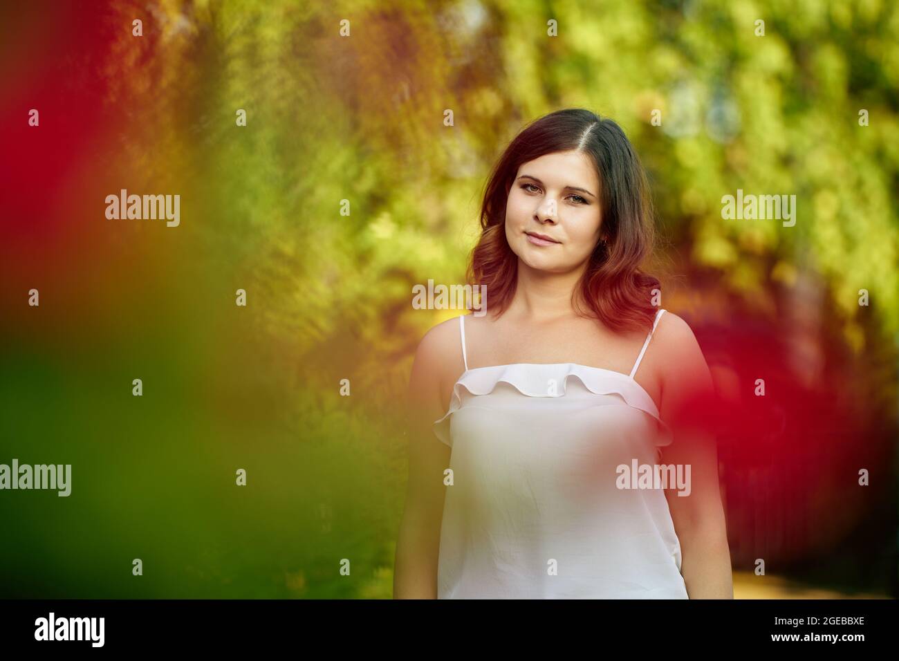 White young woman walks outdoors in pak. Stock Photo