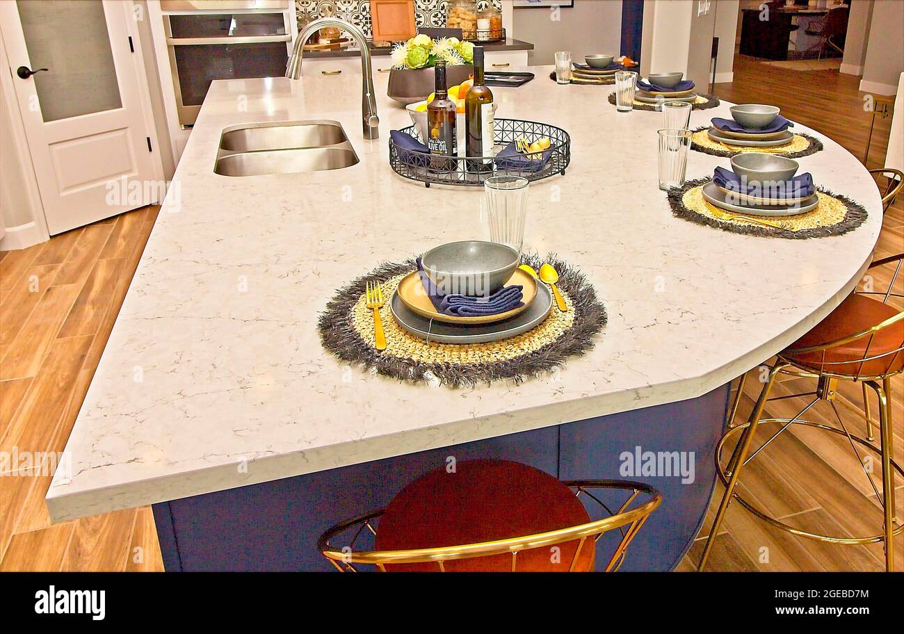 Kitchen Island Counter Top With Five Place Settings Stock Photo Alamy