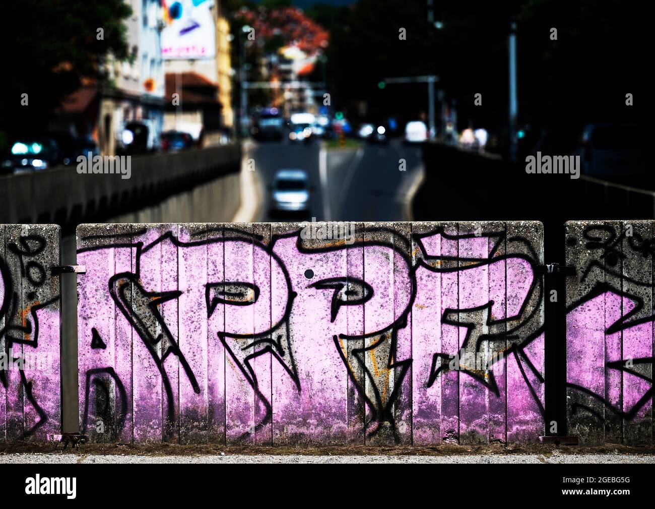 High contrast image of busy city streets with graffiti in the foreground, Zagreb, Croatia Stock Photo