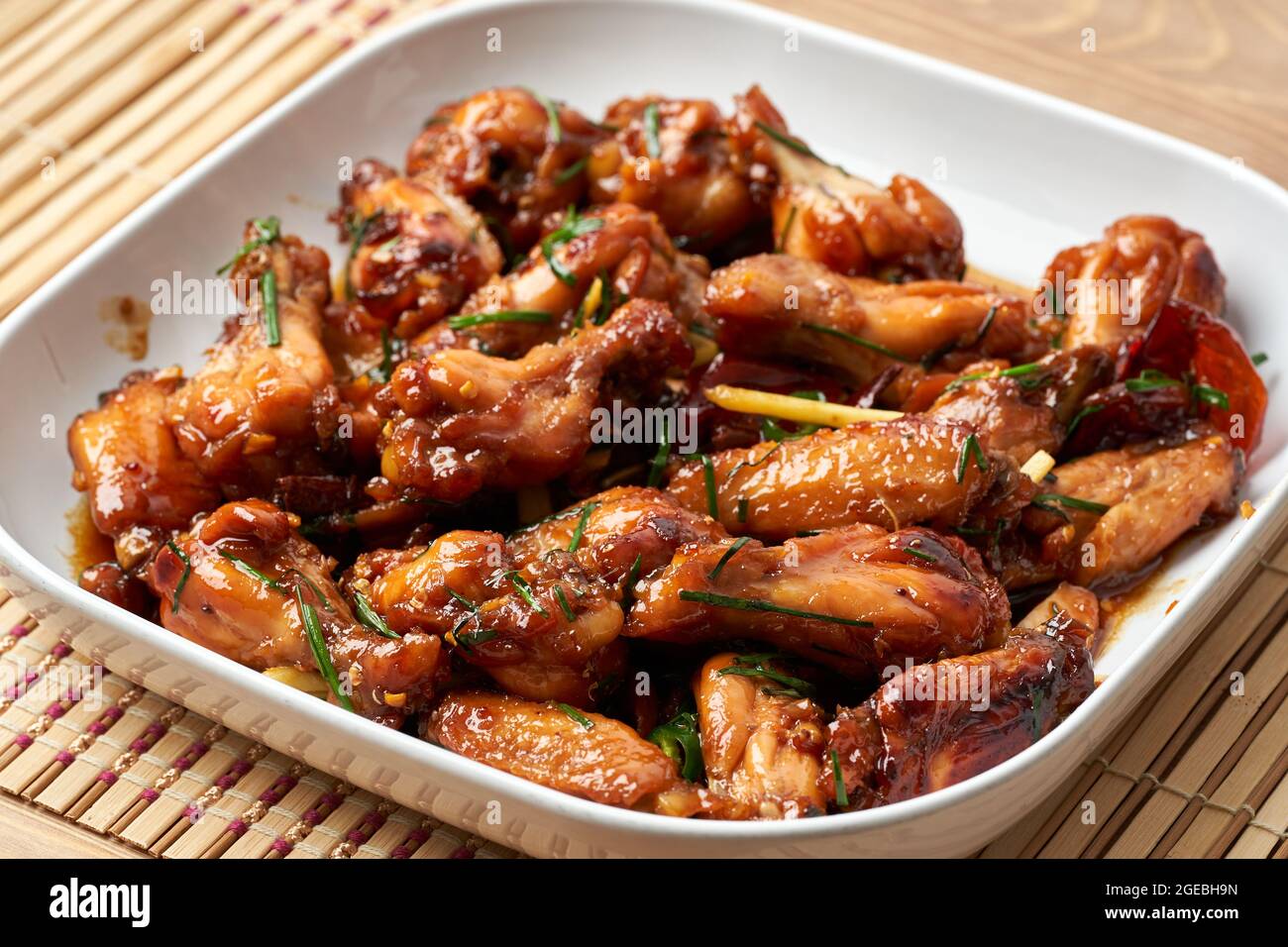 Caramelized asian spicy chicken wings in closeup Stock Photo Alamy
