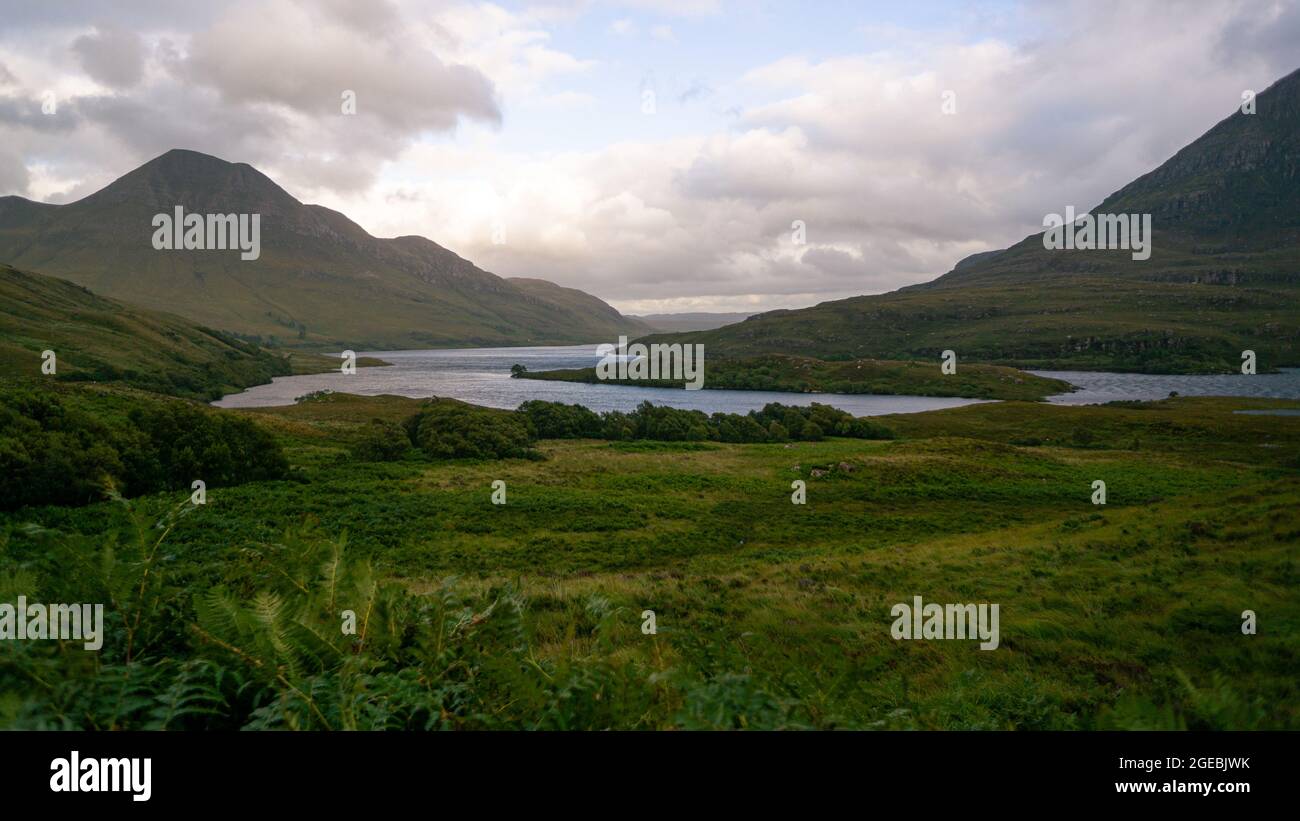 View of Scottish Highlands and lake surrounded by mountains Stock Photo