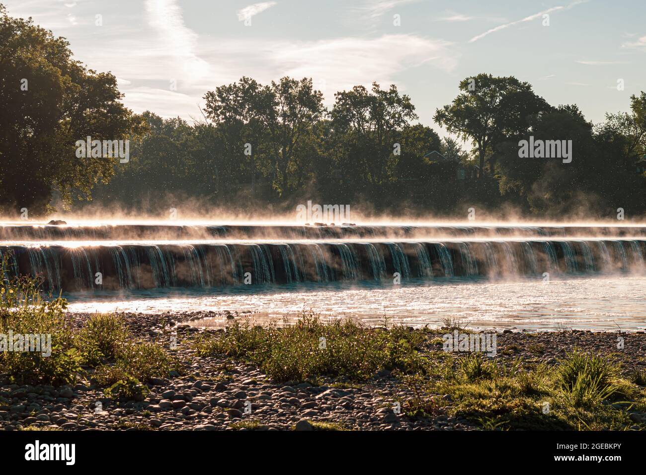Fog rising off a weir in the morning in Brantford, Ontario, Canada. Stock Photo