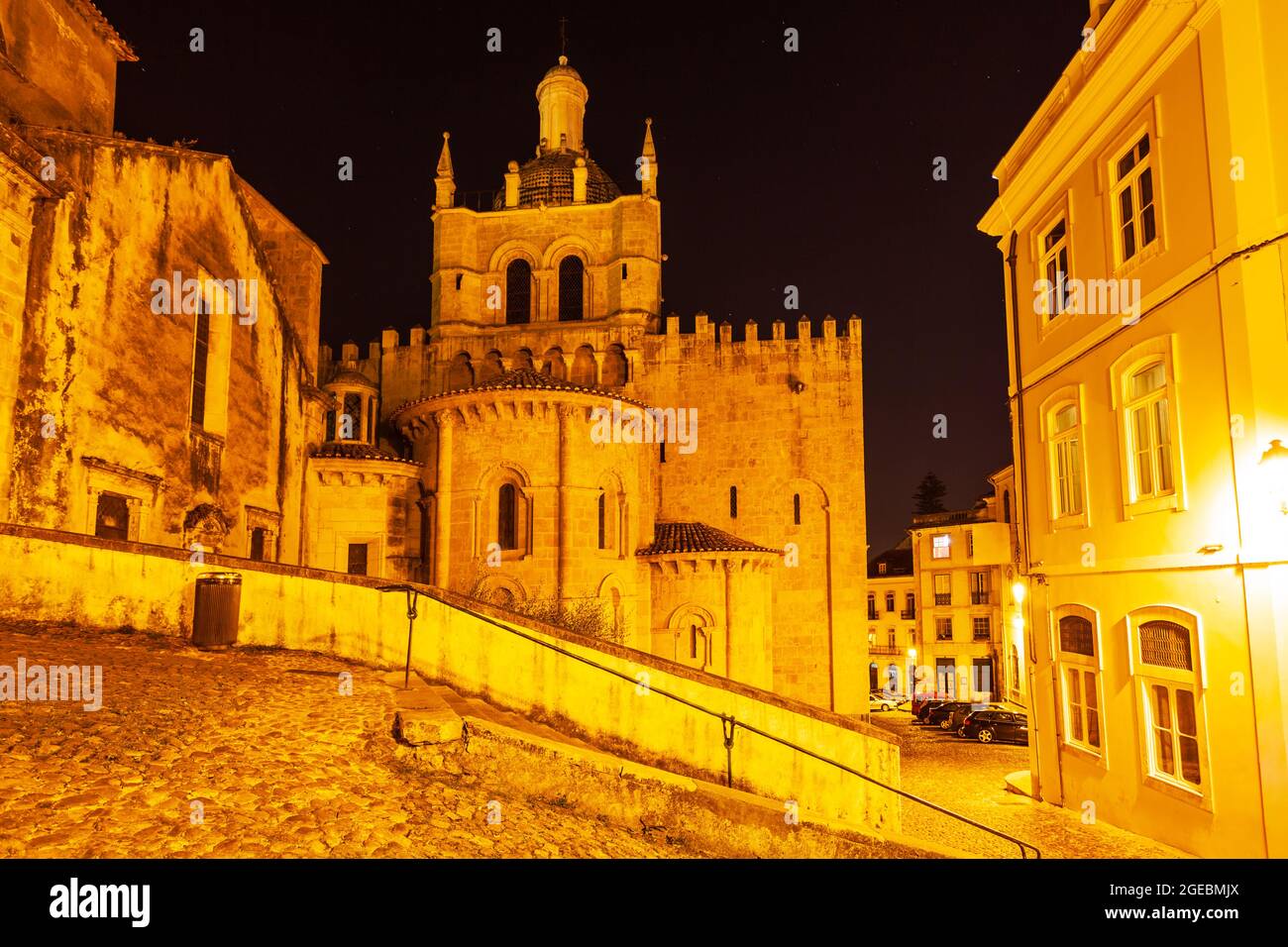 Old Cathedral of Coimbra or Se Velha de Coimbra is a roman catholic church in Coimbra city, Portugal at night Stock Photo