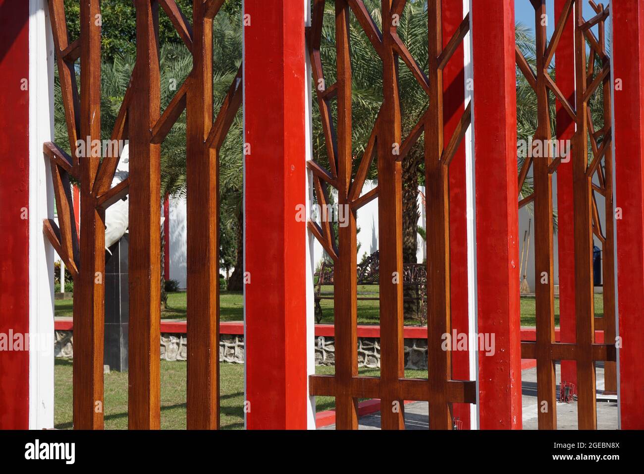 Modern red fence with a natural background Stock Photo - Alamy