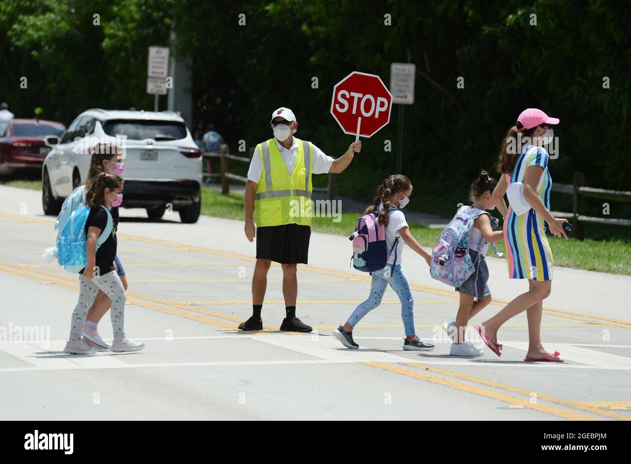 Parkland. 18th Aug, 2021. Parents seen picking up their masked children from Riverglades Elementary School as Public schools open in Broward County Florida as Chairwoman Rosalind Osgood of Broward County School Board had no choice but to defy Gov. Ron DeSantis's ban on mask mandates on August 18, 2021 in Parkland, Florida. Credit: Mpi04/Media Punch/Alamy Live News Stock Photo
