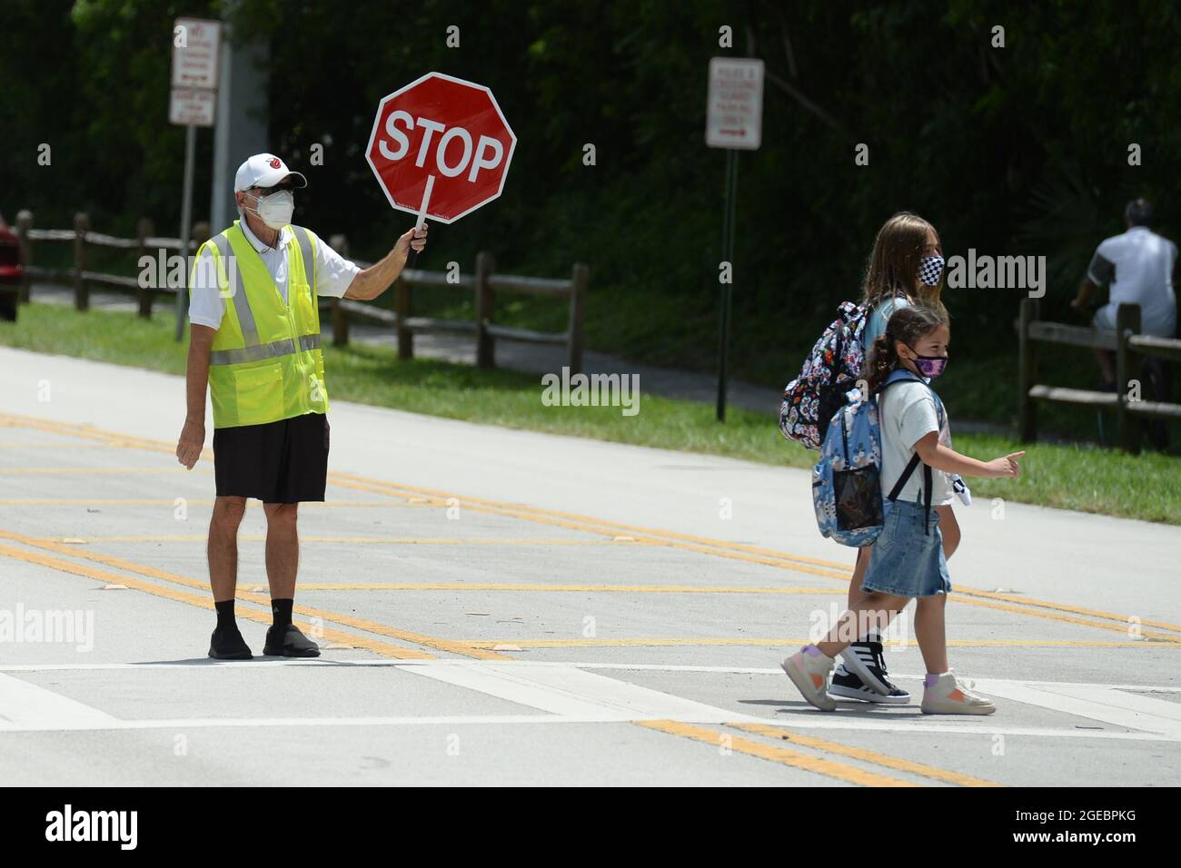 Parkland. 18th Aug, 2021. Parents seen picking up their masked children from Riverglades Elementary School as Public schools open in Broward County Florida as Chairwoman Rosalind Osgood of Broward County School Board had no choice but to defy Gov. Ron DeSantis's ban on mask mandates on August 18, 2021 in Parkland, Florida. Credit: Mpi04/Media Punch/Alamy Live News Stock Photo
