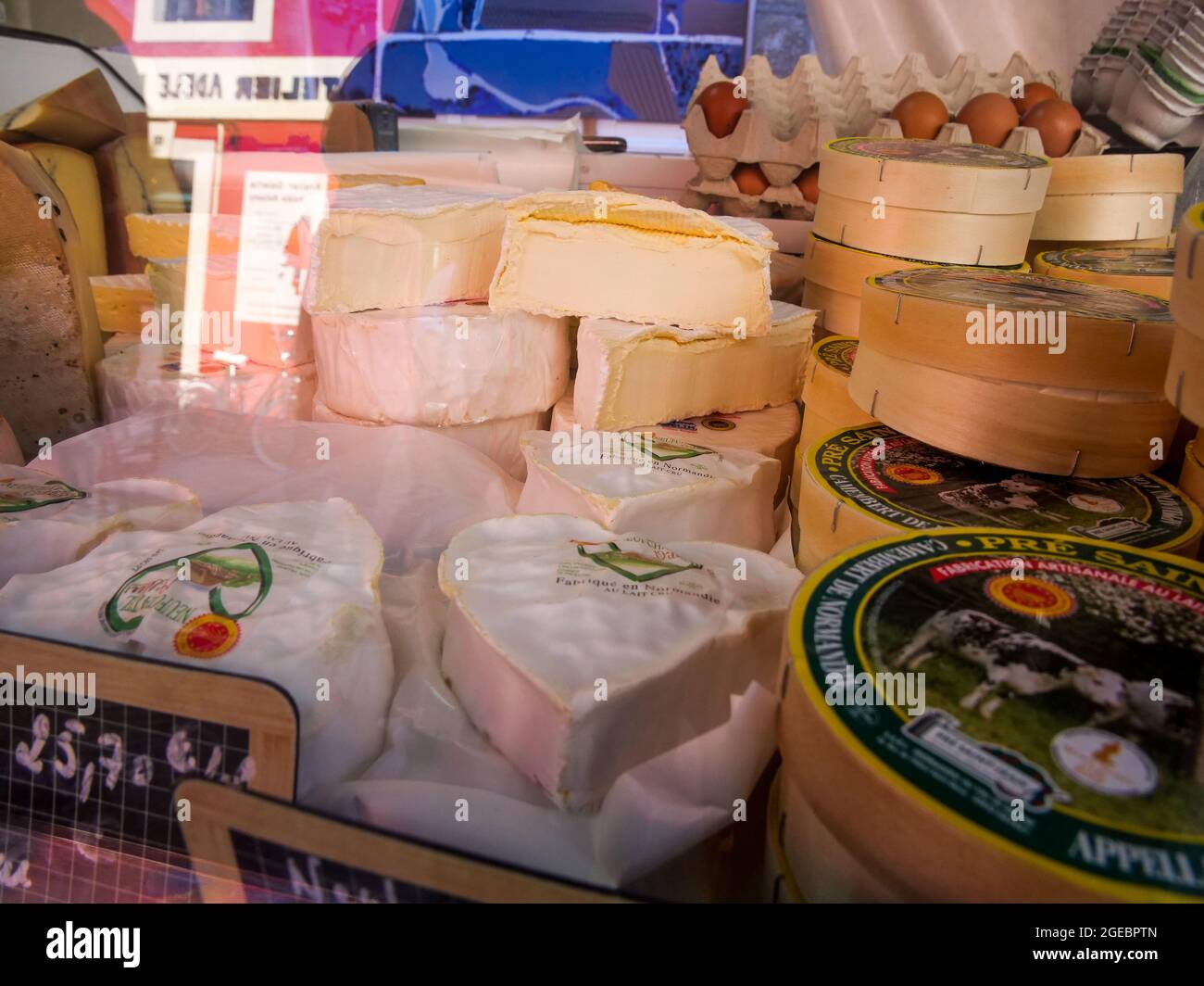 Cheese on a cheese maker stall, open air market, Saint-Vaast la Hougue, Manche department, Cotentin, Normandy region, France Stock Photo