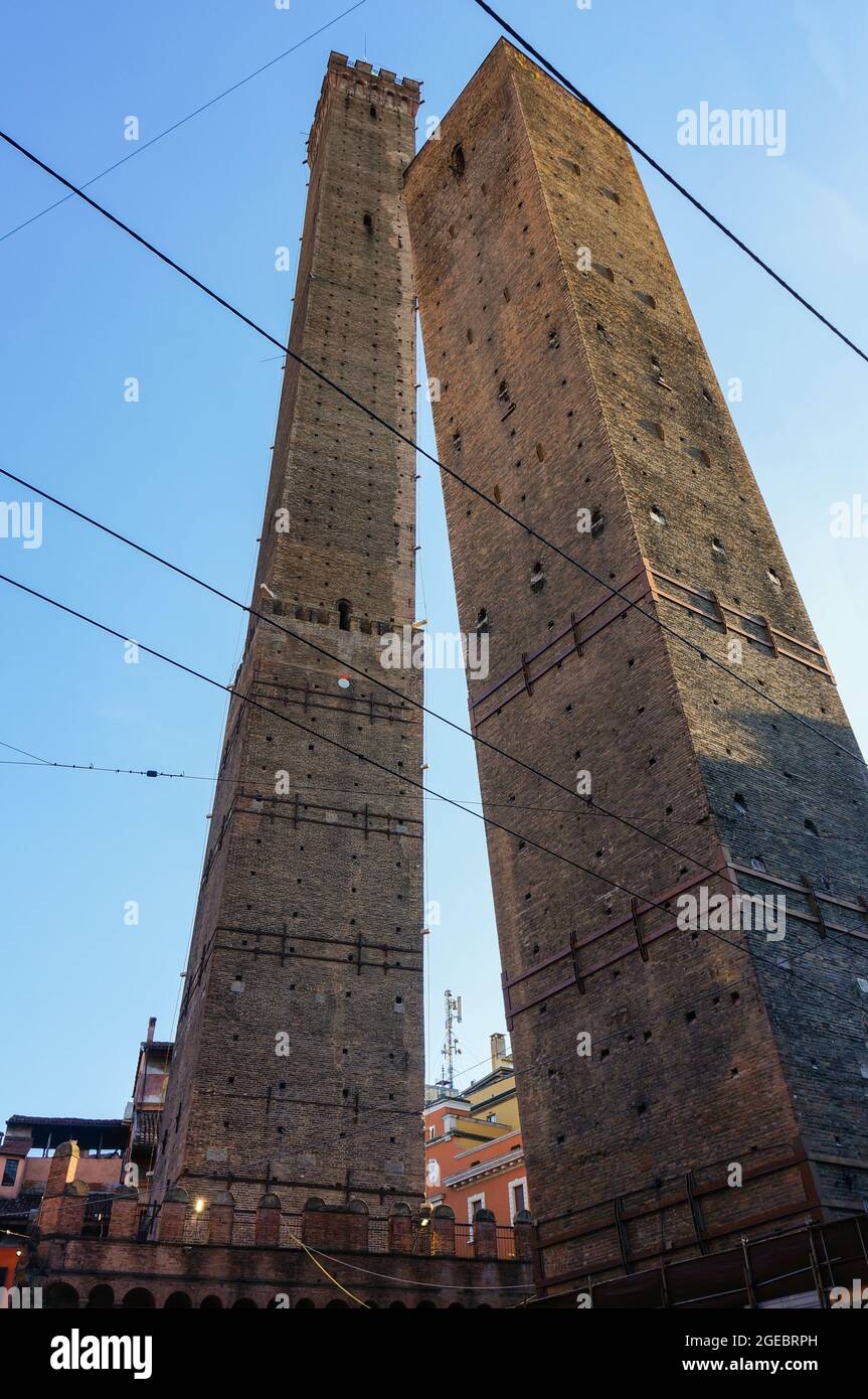 The medieval towers of the city-center of Bologna: Torre degli Asinelli (left, 97 meters high) and Torre Garisenda (right, 47 meters high) Stock Photo