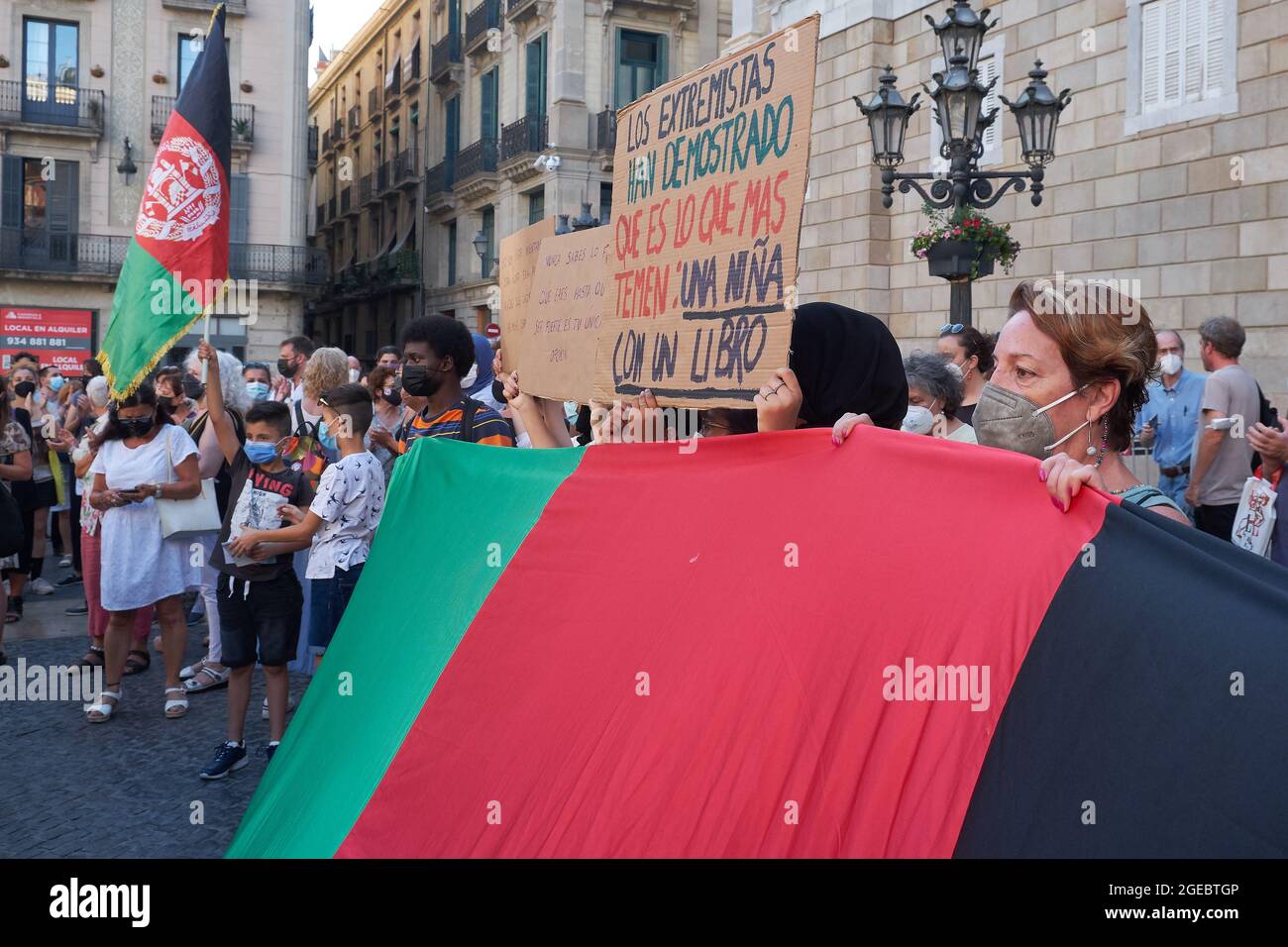 A group of activists with a sign that reads: 'The extremists have shown that it is what they fear: a girl with a book' during the concentration in the Stock Photo