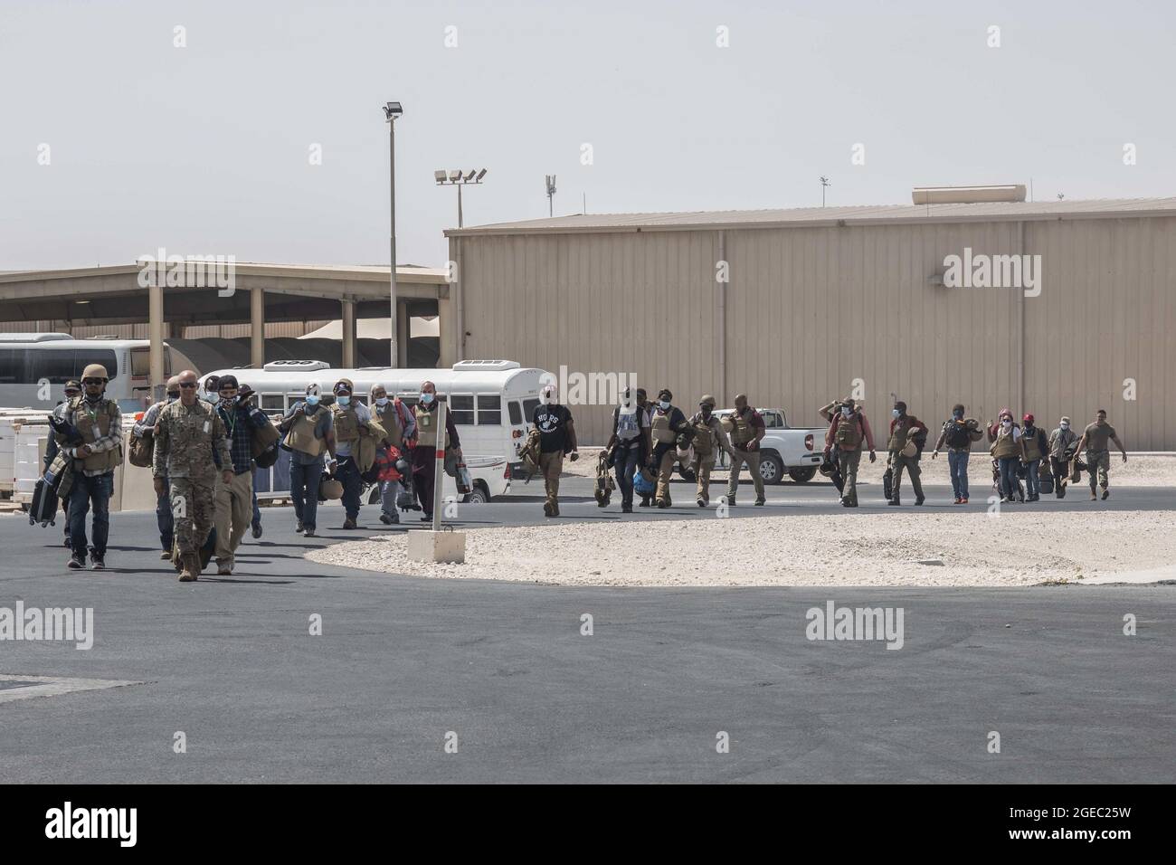 Al Udeid Air Base, Qatar. 18th Aug, 2021. U.S. Embassy personnel from