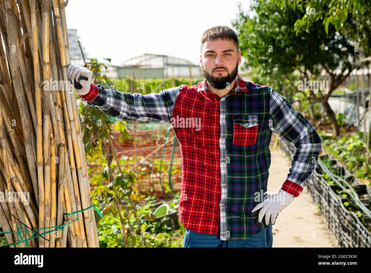Portrait of a confident gardener at a summer cottage Stock Photo - Alamy