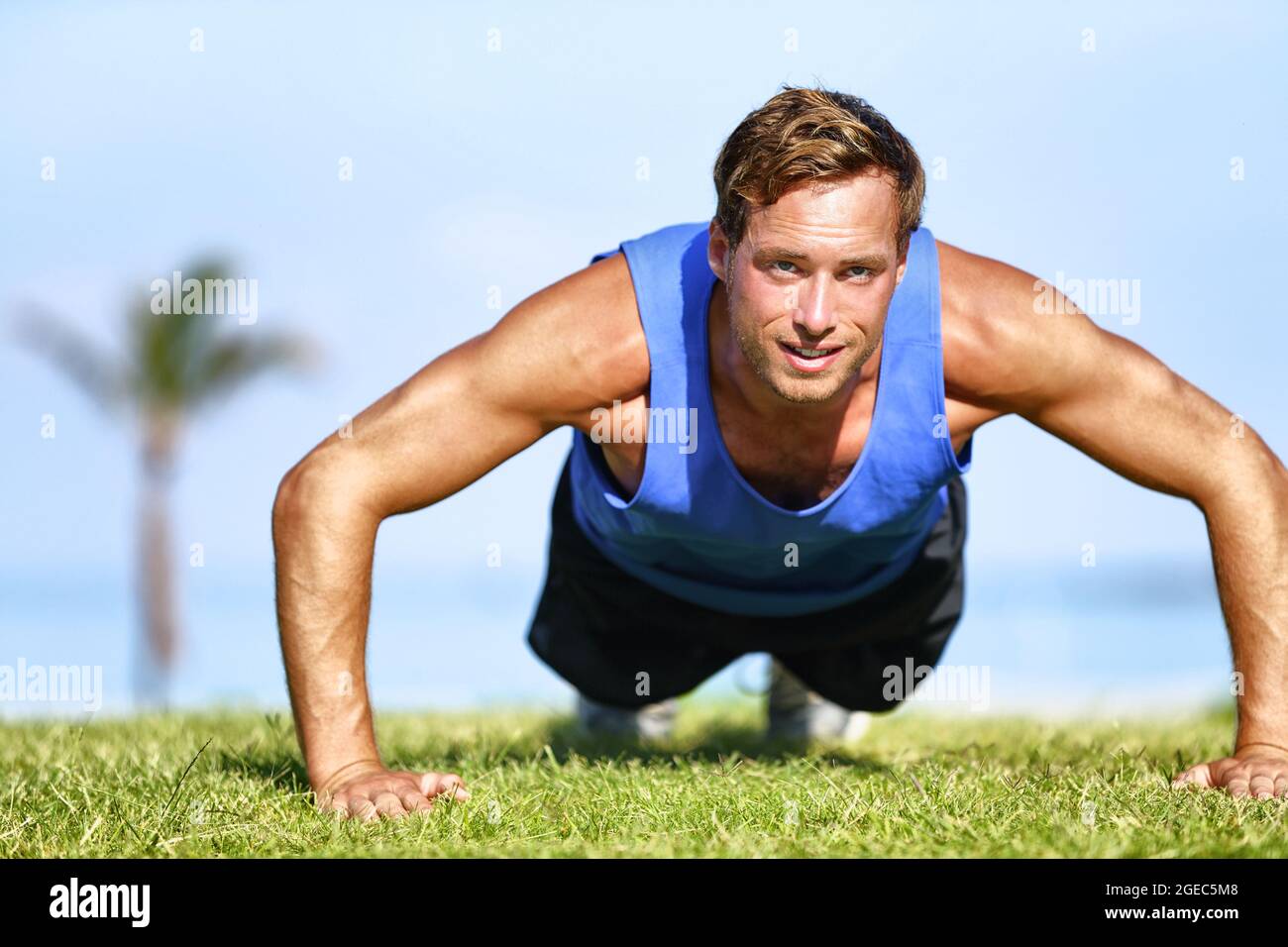 Fit Man Doing Push Ups Exercises Strength Training Outdoor On Beach Fit Man Doing Push Ups Exercises Strength Training Outdoor On Beach