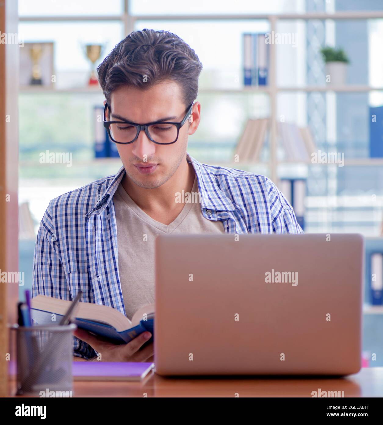 The student studying at home preparing for exam Stock Photo - Alamy