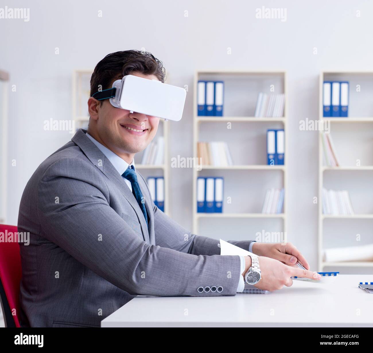 The businessman with virtual reality glasses in the office Stock Photo ...